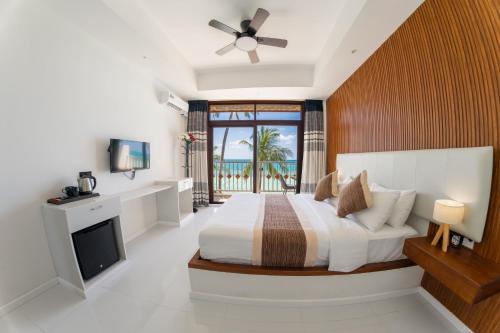 Dhiffushi House | Heron Beach Hotel Dhiffushi Stay Seven Nights or More and Enjoy Free Roundtrip Airport Speedboat for Two Adults for Stay Dates Until 30 November 2026