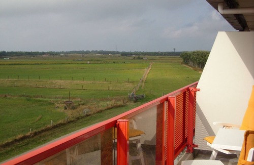 Buren Apartment | Ameland - apartment with balcony to the south side with a view of meadows and the village of Buren