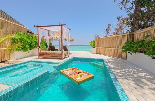 Kuda Bandos Resort | Malahini Kuda Bandos Special Offer Begin your island escape with ease airport pick up and return by shared speedboat at just USD 50 per person stays stay untill end October 2026