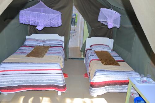 Rhino Tourist Camp in Ololaimutiek