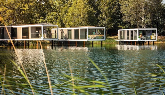 Unique cube for two beautifully located above the water. Enjoy luxury air conditioning and an atmospheric terrace with panoramic views. in Maasbree