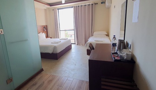 Deluxe Triple Room, Balcony, Courtyard Area